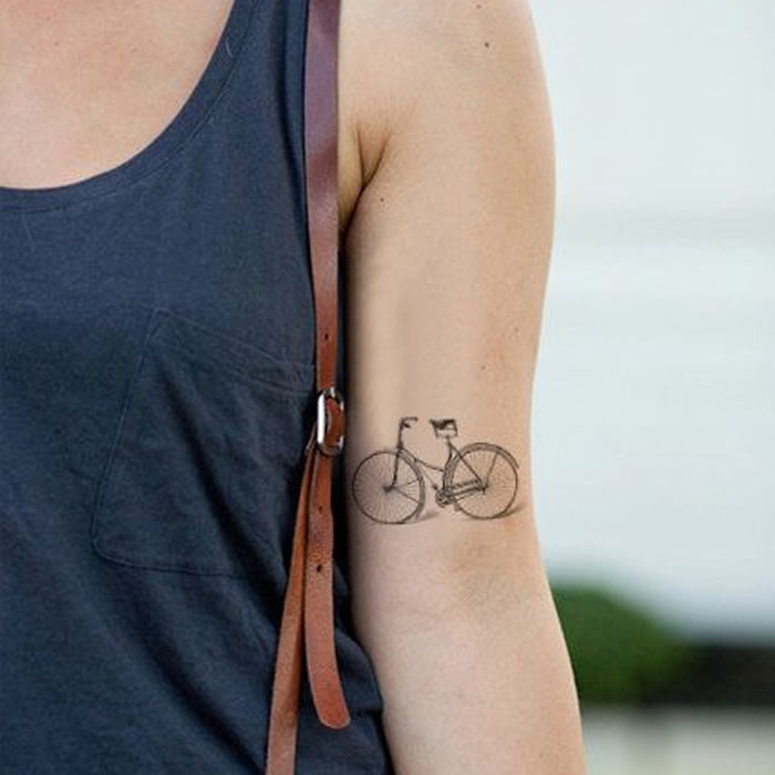 Black Bike Tattoo On Girl Left Half Sleeve
