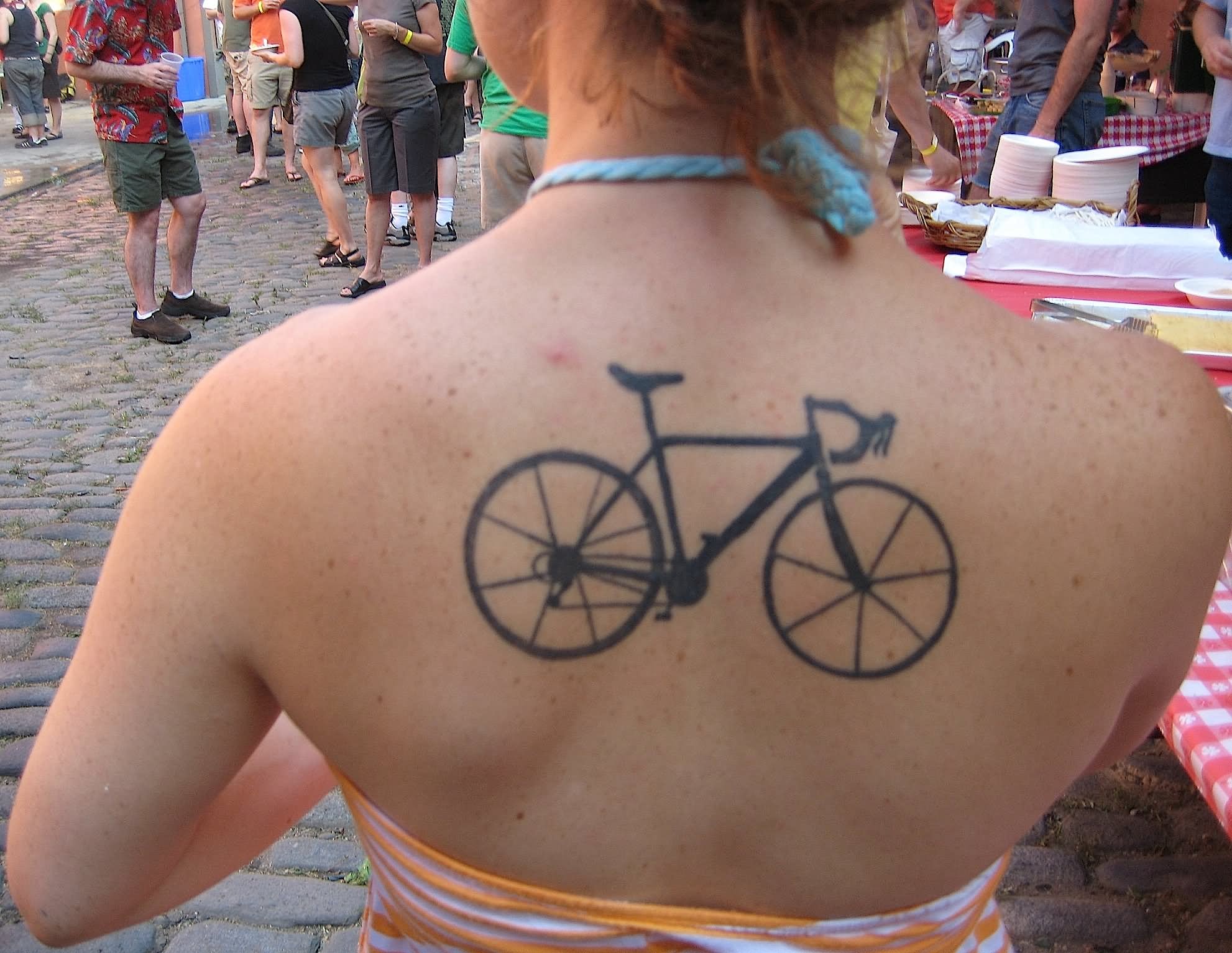 Black Bike Tattoo On Girl Upper Back