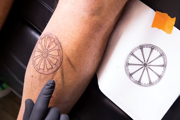 Black Bike Wheel Tattoo On Leg Calf