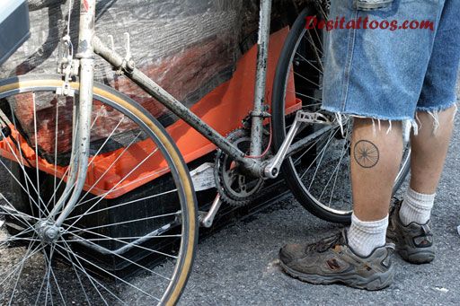 Black Bike Wheel Tattoo On Leg
