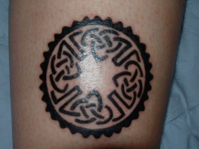 Black Celtic Gear Tattoo On Leg Calf