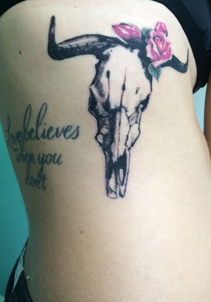Black Cow Skull With Pink Flower Tattoo On Side Rib