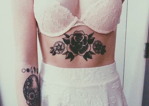 Black Flowers Tattoo On Girl Belly