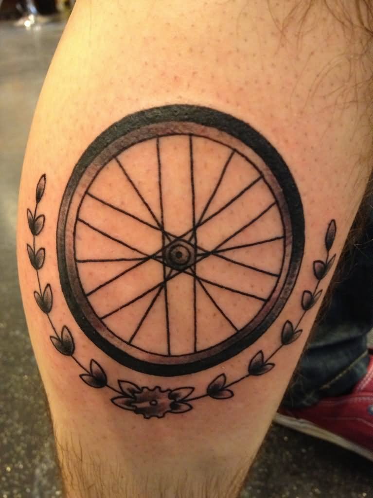 Black Ink Bike Wheel Tattoo On Leg Calf