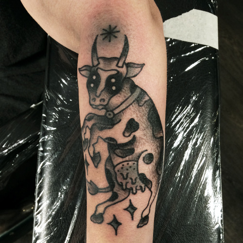 Black Ink Cow Tattoo On Forearm