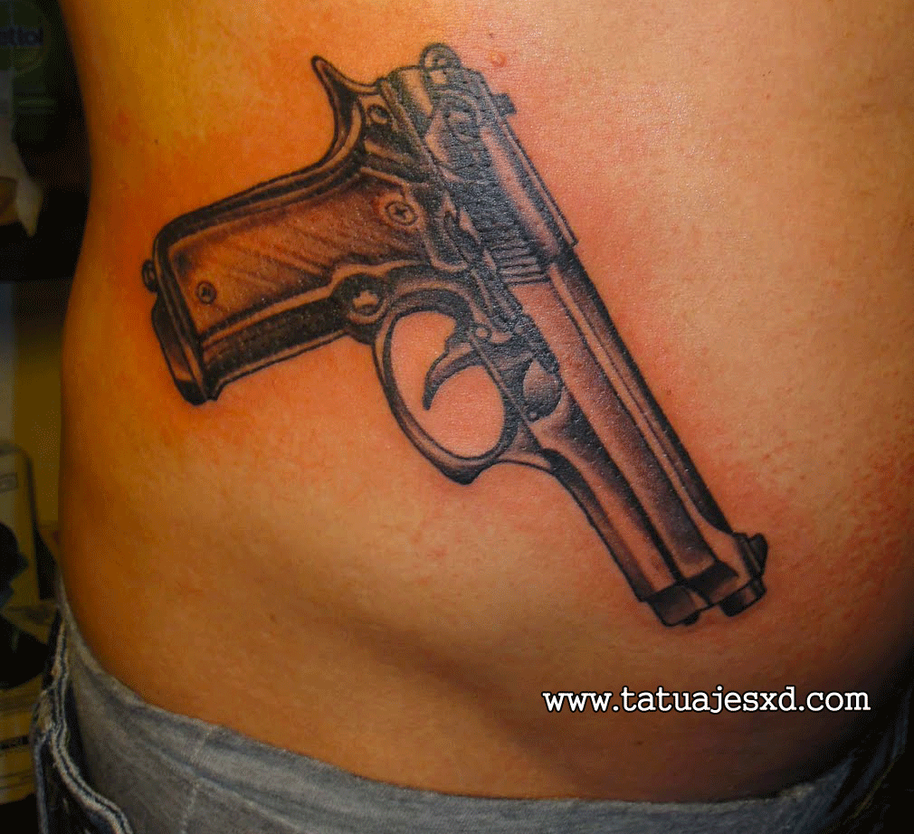 Black Ink Gun Tattoo On Side Belly