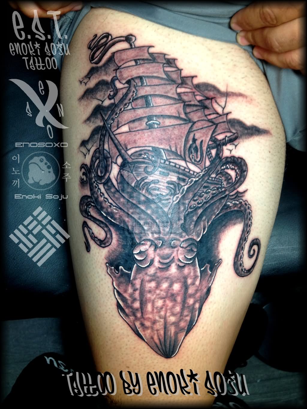 Black Ink Kraken Attacking Ship Tattoo On Thigh