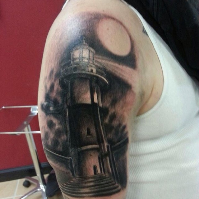 Black Ink Lighthouse Tattoo On Man Right Half Sleeve