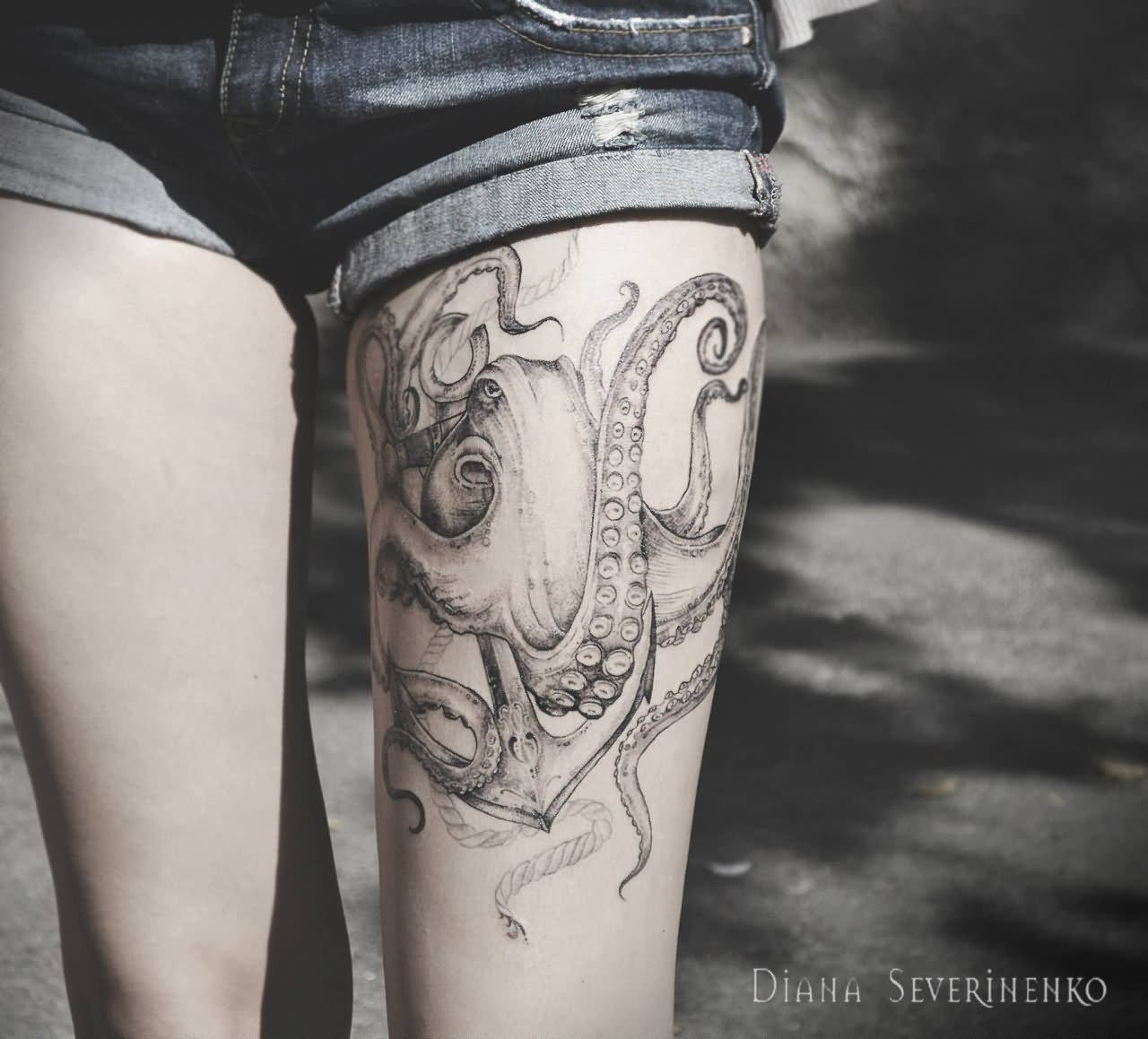 Black Kraken With Anchor Tattoo On Thigh