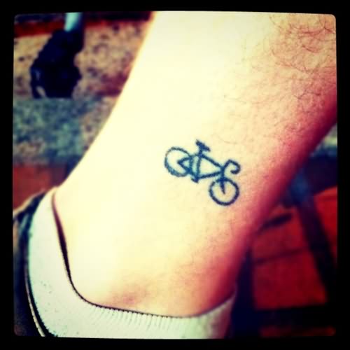 Black Little Bike Tattoo On Leg