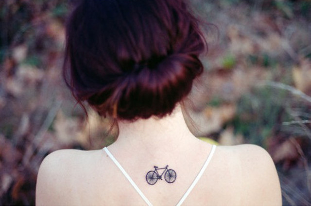 Black Little Mountain Bike Tattoo On Girl Upper Back