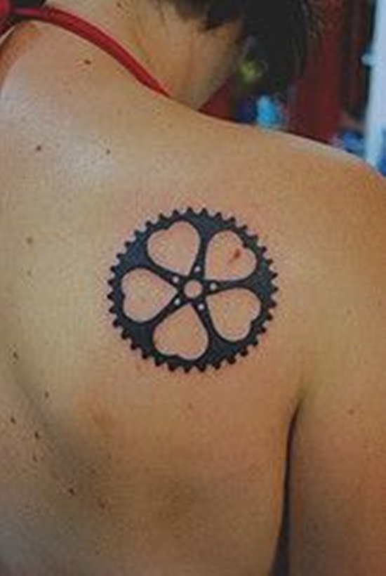 Black Mountain Bike Sprocket Tattoo On Girl Right Back Shoulder