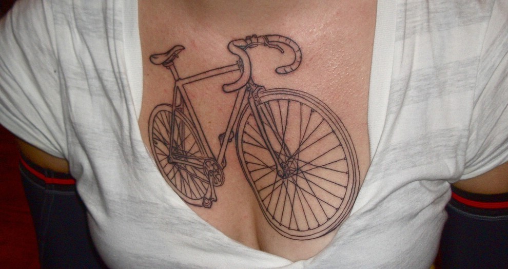 Black Mountain Bike Tattoo On Girl Collarbone