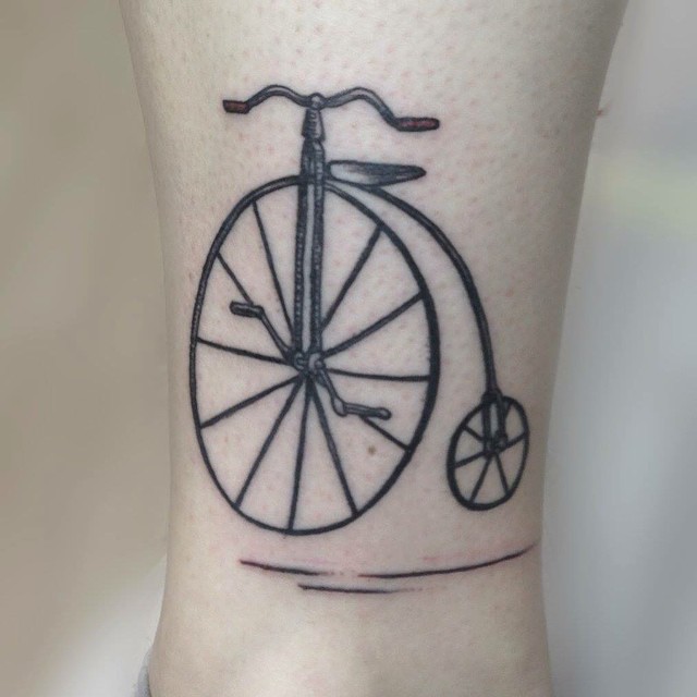 Black Penny Farthing Bike Tattoo Design For Leg