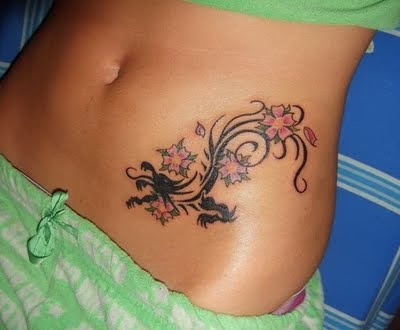 Black Tribal Dragon With Flowers Tattoo On Belly