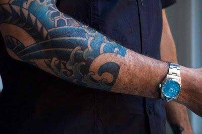 Blue Ink Aqua Tattoo On Right Forearm