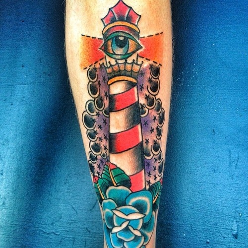 Blue Rose And One Eye Lighthouse Tattoo On Leg