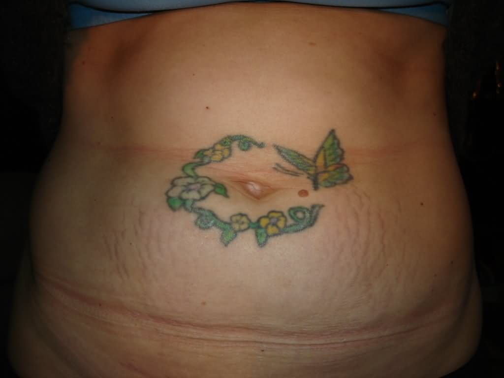 Butterfly With Flowers Tattoo On After Pregnancy Belly