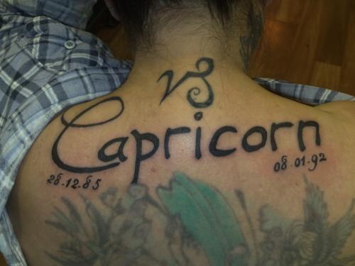 Capricorn With Flowers Tattoos On Back