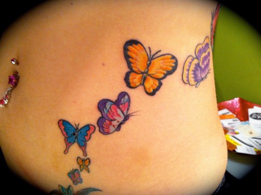 Colorful Butterfly Tattoo On Side Belly