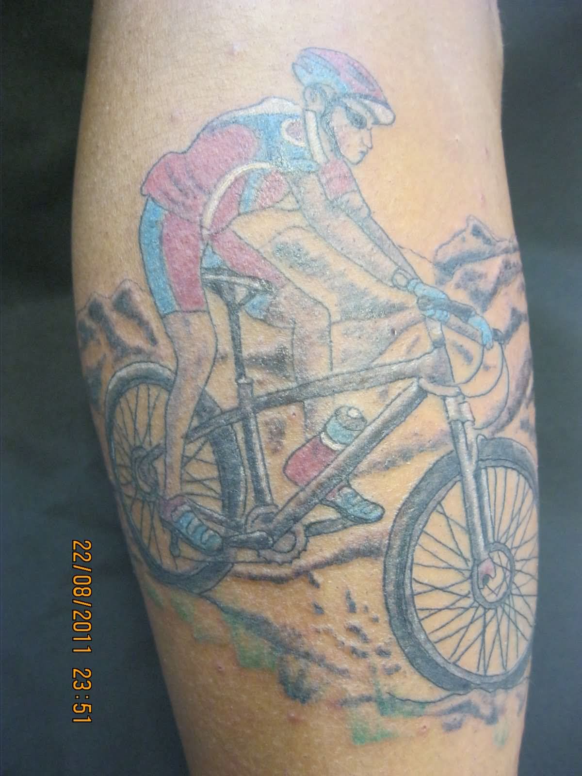 Colorful Man Riding Mountain Bike Tattoo Design