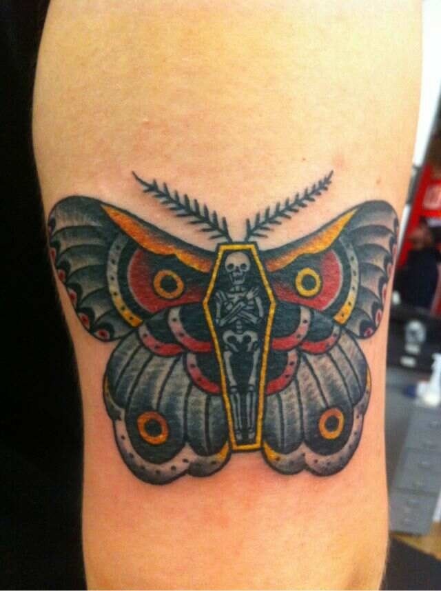 Colorful Moth With Skeleton Coffin Tattoo On Bicep
