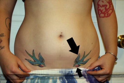 Colorful Two Flying Birds Tattoo On After Pregnancy Belly