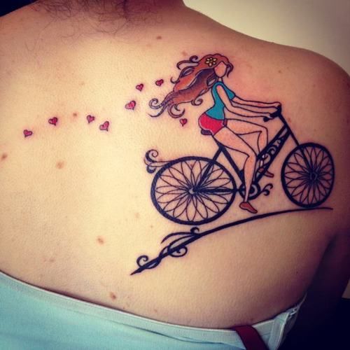 Cute Girl Riding Bike Tattoo On Right Back Shoulder
