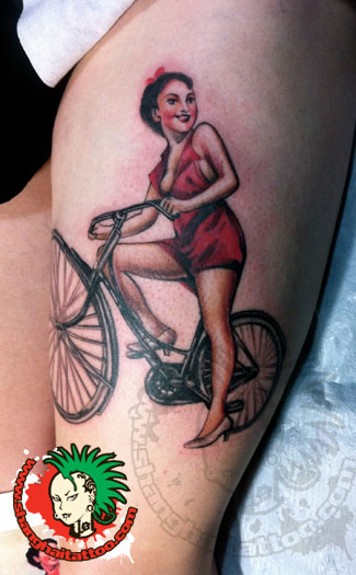 Cute Girl Riding Bike Tattoo On Thigh