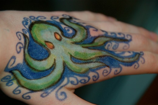 Cute Green Octopus Tattoo On Hand