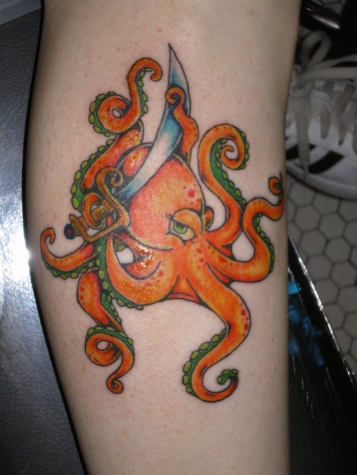 Cute Octopus With Dagger Tattoo