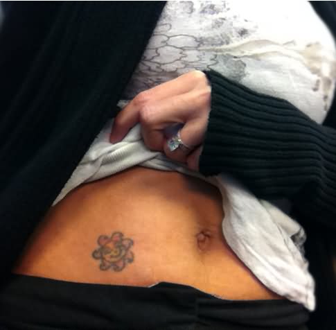 Cute Sun Tattoo On After Pregnancy Belly