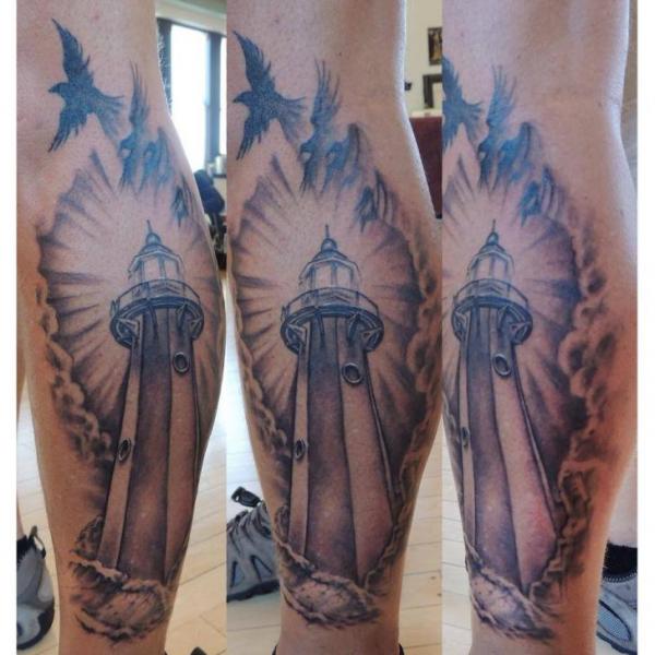 Flying Bird And Lighthouse Tattoo On Back Leg