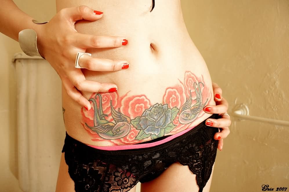 Flying Birds With Flowers Tattoo On Girl Belly