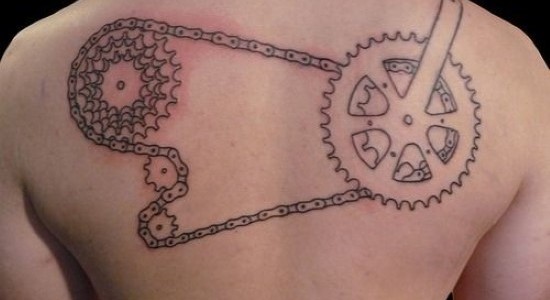 Four Bike Gear With Chain Tattoo On Upper Back