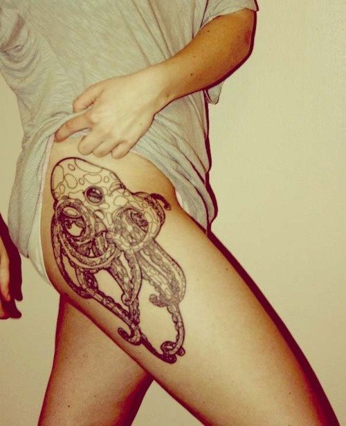 Girl Showing Her Octopus Thigh Tattoo
