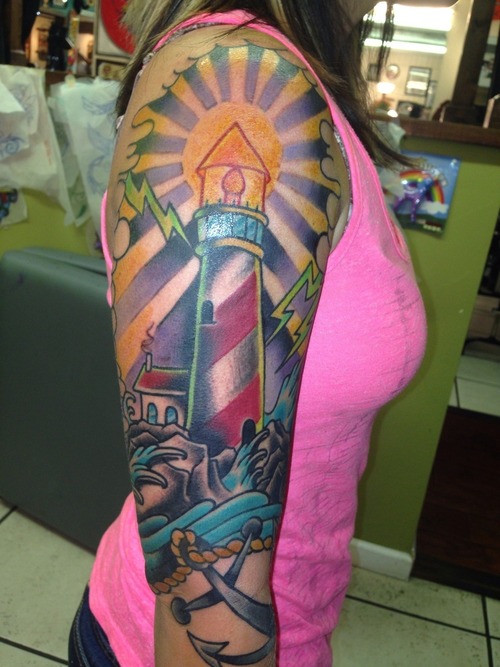 Girl Showing Her Right Sleeve Lighthouse Tattoo