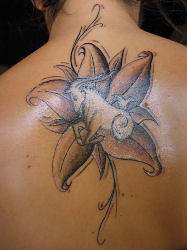 Grey Ink Capricorn With Flower Tattoo On Back