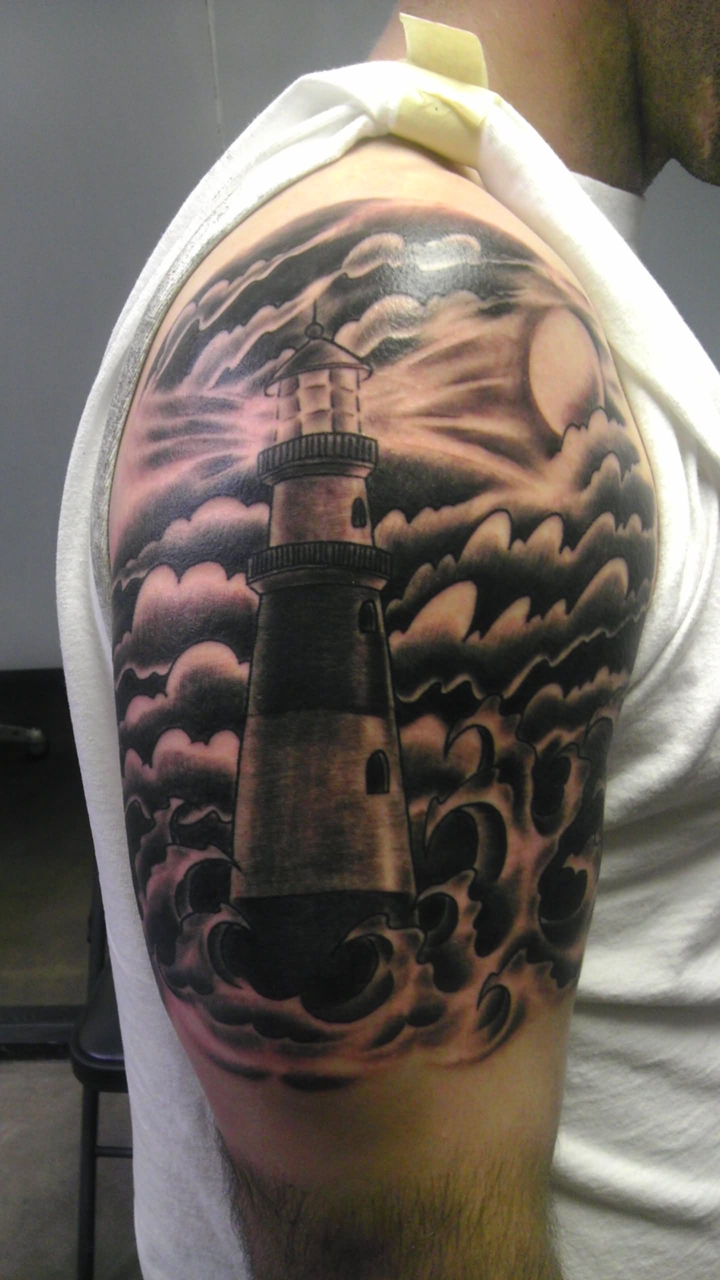 Grey Lighthouse Tattoo On Man Right Shoulder