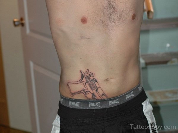 Gun Tattoo On Man Belly