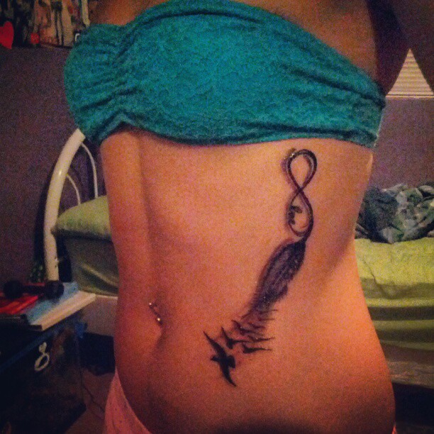 Infinity With Flying Birds Tattoo On Girl Side Belly