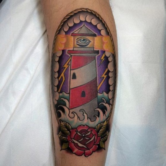 Lighthouse In Frame With Rose Tattoo On Leg