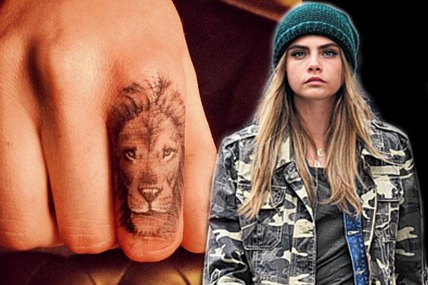 Lion Tattoo On Celebrity Cara Delavigne Finger