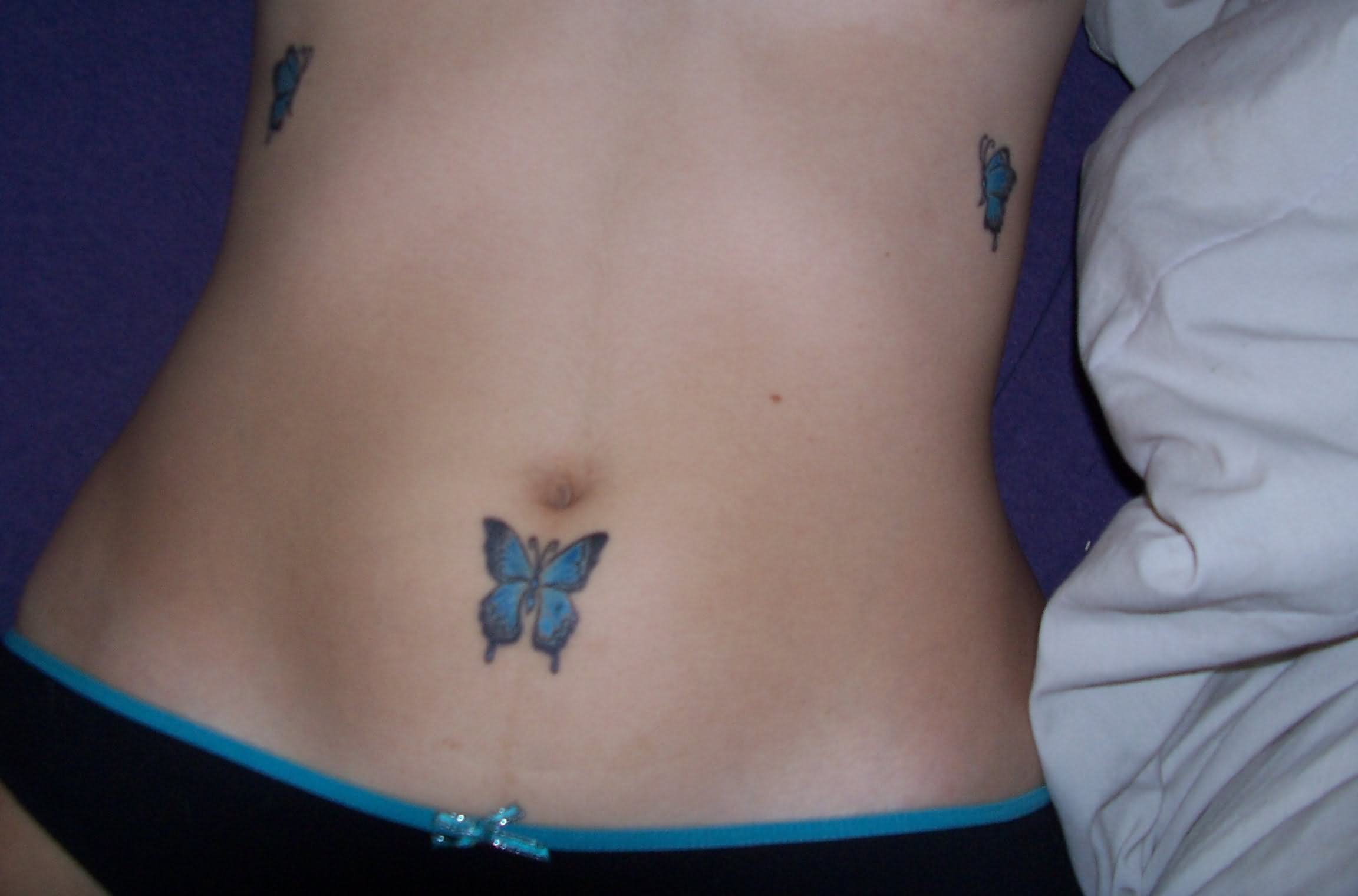 Little Butterfly Tattoo On Belly Button