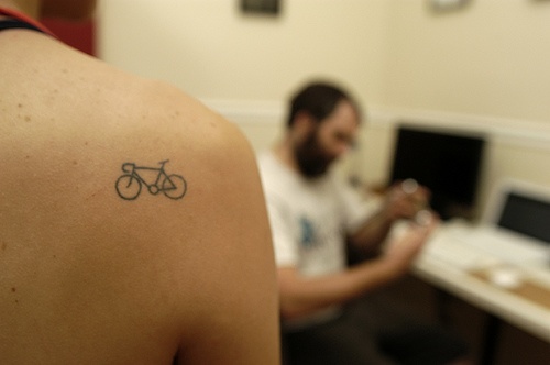 Little Simple Bike Tattoo On Right Back Shoulder