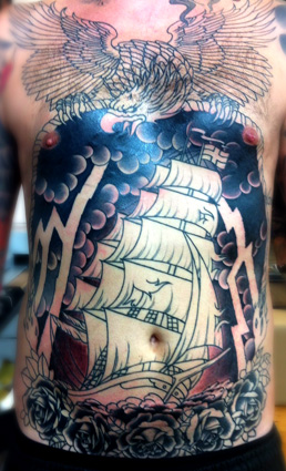 Man With Light House Tattoo On Body
