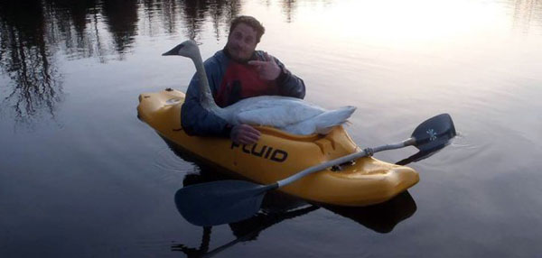 Man With Swan In Boat Funny Wtf Image