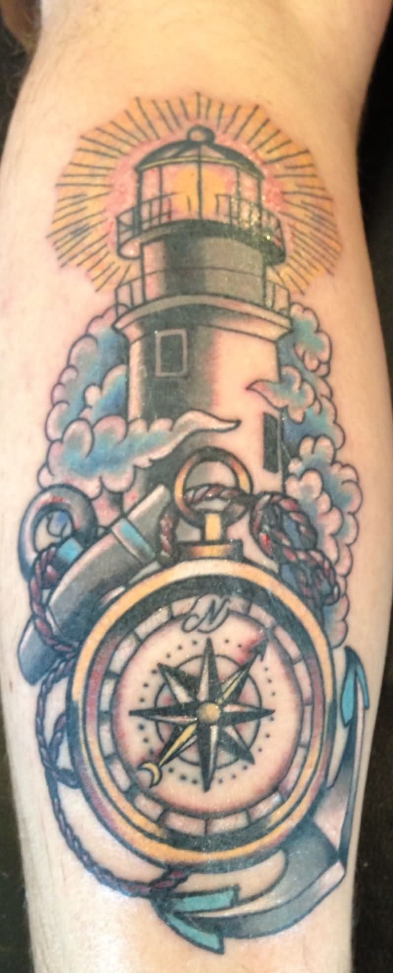 Nautical Compass Lighthouse Tattoo On Leg