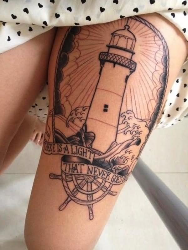 Nice Compass And Lighthouse Tattoo On Left Thigh