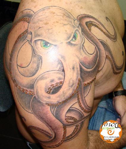 Nice Green Eyed Octopus Tattoo On Shoulder
